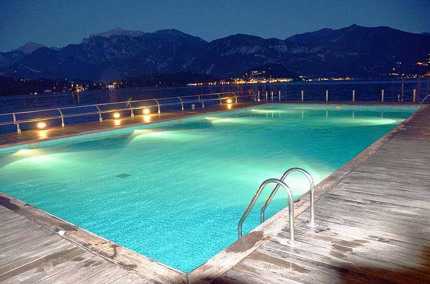 swimming pool pool water lights reflection night horizon blue azur